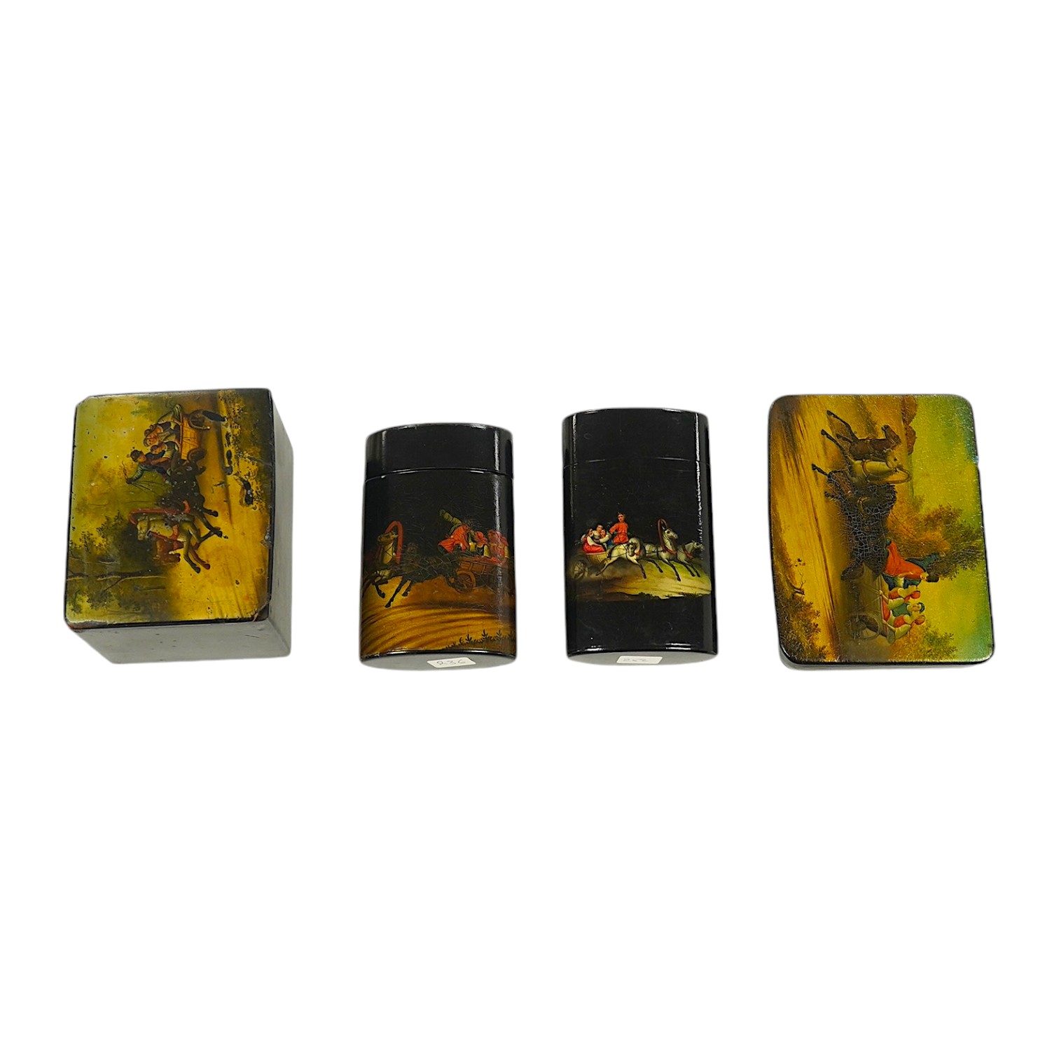 Four Russian lacquer boxes, late 19th/early 20th century, decorated with troika scenes, largest 12cm wide. Condition - fair